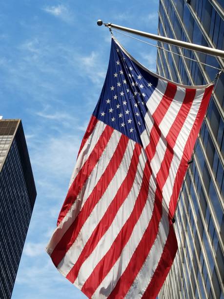 istock American flag and office buildings 1135874020