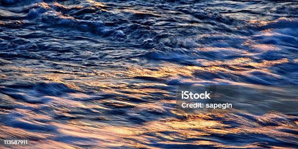 Sea Waves At Sunset Stock Photo - Download Image Now - Abstract, Backgrounds, Blue