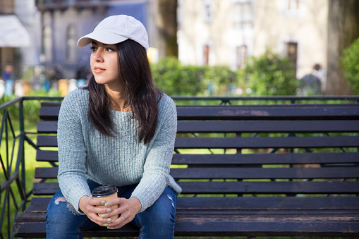 Pretty young woman portrait in public park.\nIstanbul - Turkey.