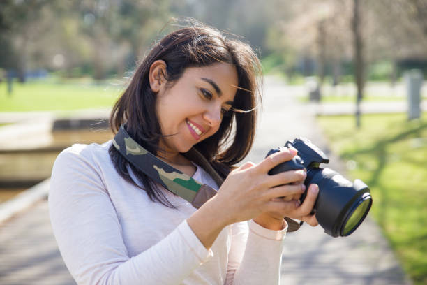 istock Happy inspired photographer checking pictures 1135881042