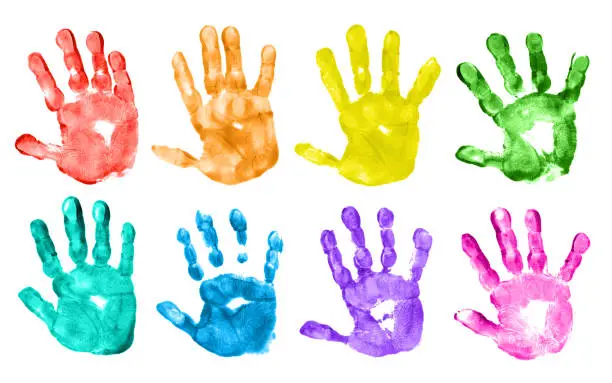 Colorful children’s hand prints on white background.
