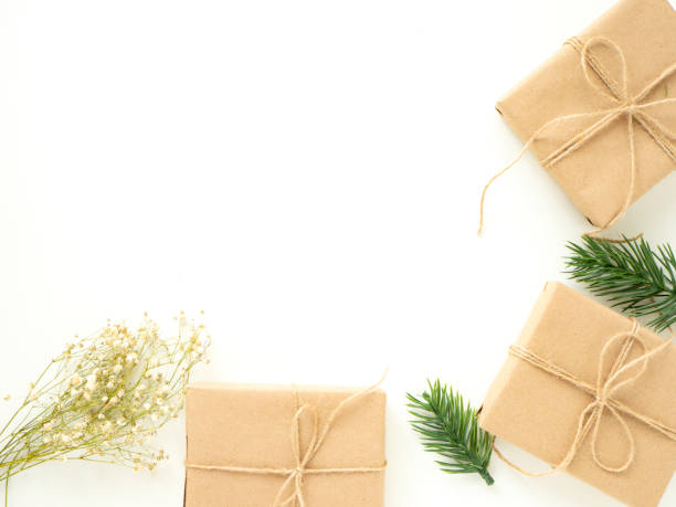 istock 2019 Christmas Gifts with Fir Branches on White 1135891321