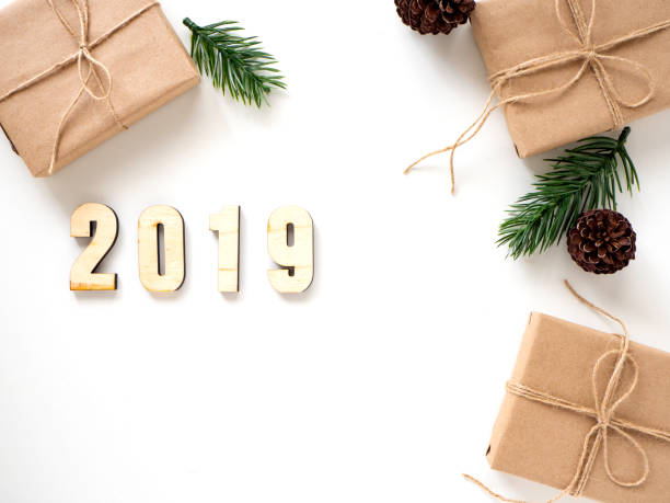 istock 2019 Christmas Gifts with Fir Branches on White 1135891333