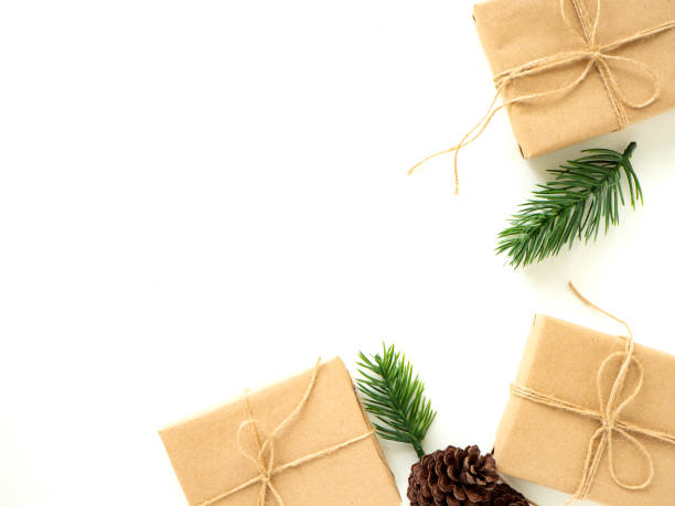 istock 2019 Christmas Gifts with Fir Branches on White 1135891340