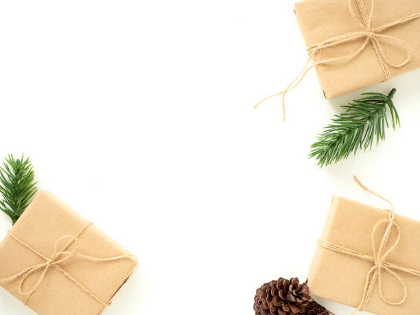 istock 2019 Christmas Gifts with Fir Branches on White 1135891345
