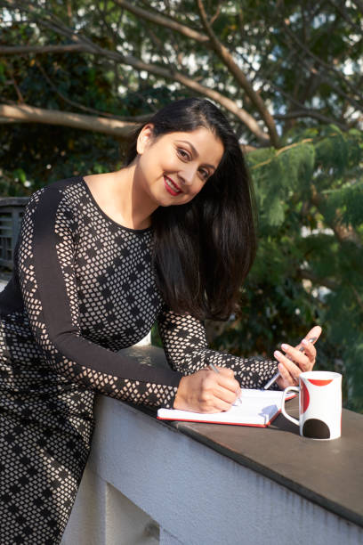 istock Pretty businesswoman planning day 1135891365
