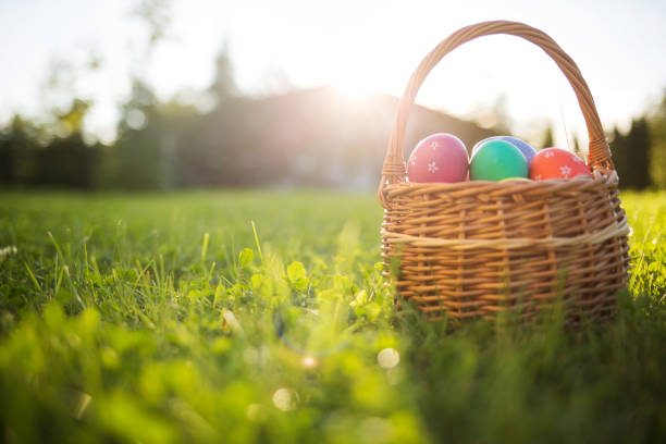 istock Easter eggs in a basket on the grass on a Sunny spring day close-up 1135891764