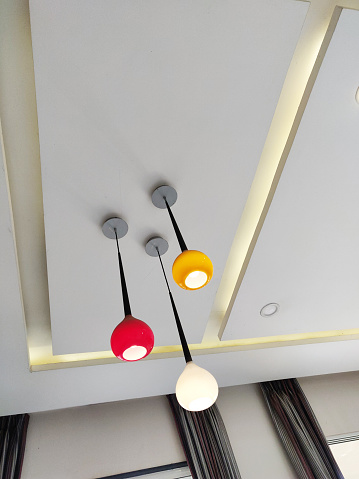 Interior design of a house with modern pendant light hanging from ceiling