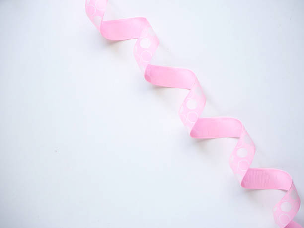 istock Pink curly ribbon on a white 1135892564