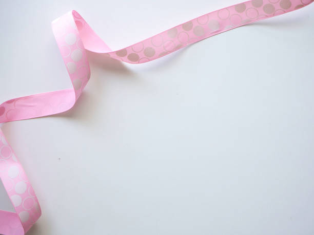 istock Pink curly ribbon on a white 1135892576