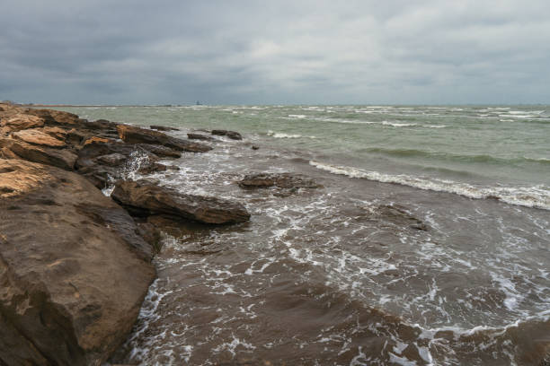 istock Rocky sea coast in cloudy weather 1135893429