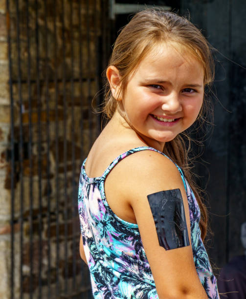 istock Ten year old girl temporary tattoo 1135899511