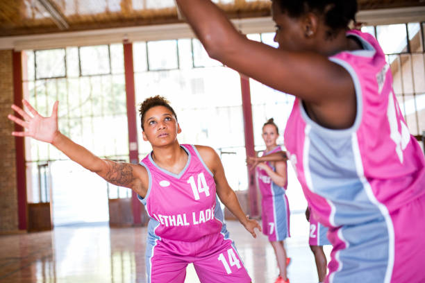 istock Female athlete defending from opposing team 1135899572