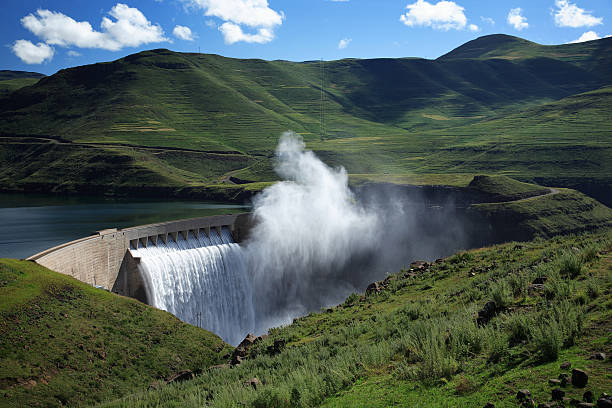 Mist rising above the Katse dam wall in Lesotho  hydroelectric power photos stock pictures, royalty-free photos & images