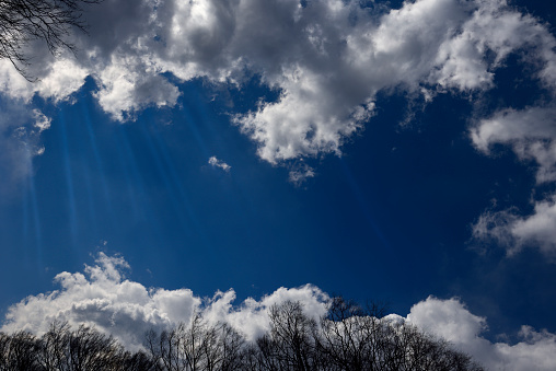 Blue sky and cloudscape frame with sunbeam.