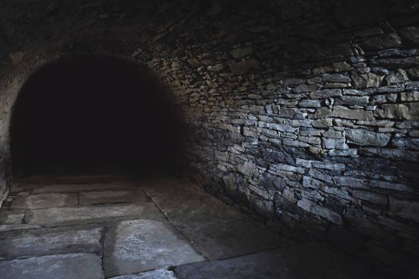 Dark scary underground, old stony cellar Scary underground, old cellar dungeon medieval prison prison cell stock pictures, royalty-free photos & images