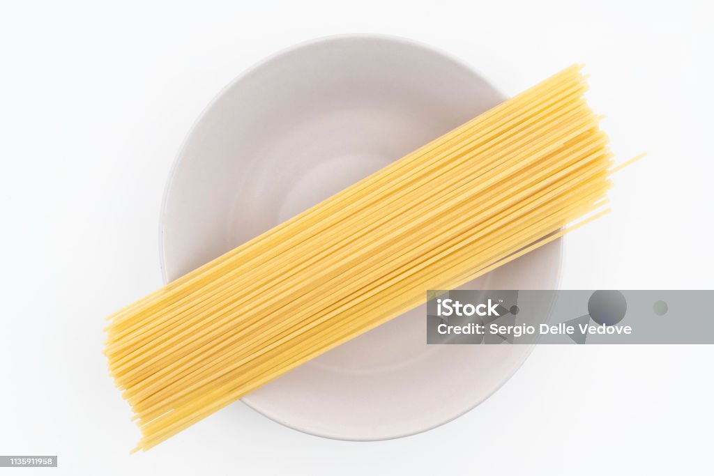 Spaghetti pasta some dried spaghetti pasta on a plate Carbohydrate - Food Type Stock Photo