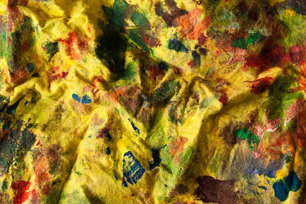 istock yellow stained fabrick with paint background 113591329