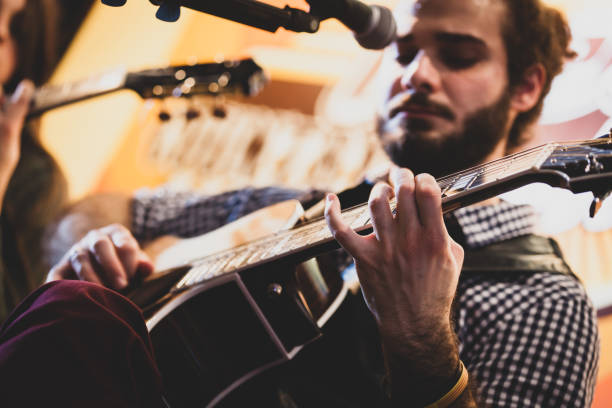 istock Low Angle View Of Man Playing Guitar 1135919121