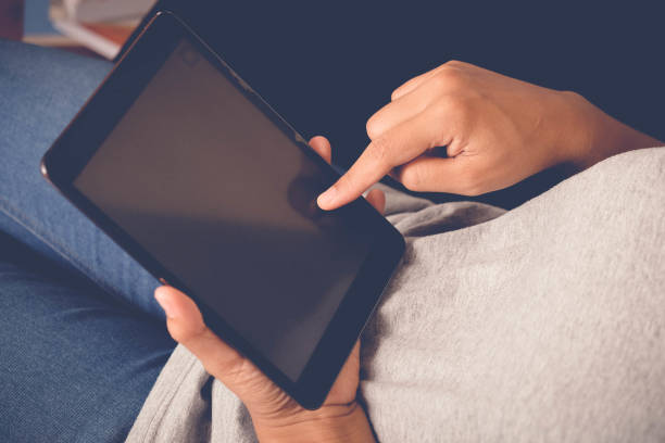 istock High Angle View Of Woman Using Digital Tablet 1135922919