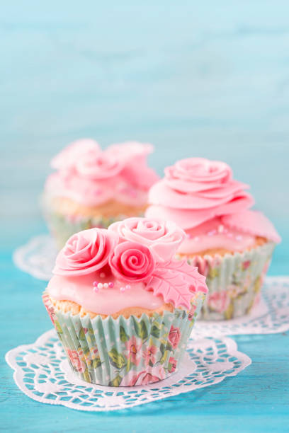 istock Cupcake with pink flowers 1135929448
