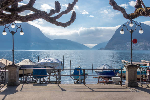 small harbor of lugano with old fishing boats - ticino canton mountain lake lugano lake imagens e fotografias de stock