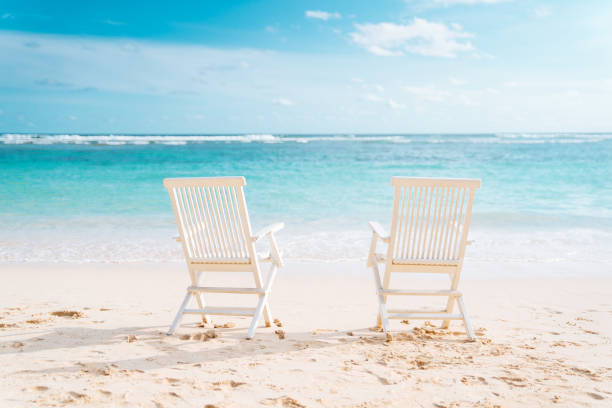 istock Bali, Bukit. Two white chairs on the beach 1135930791