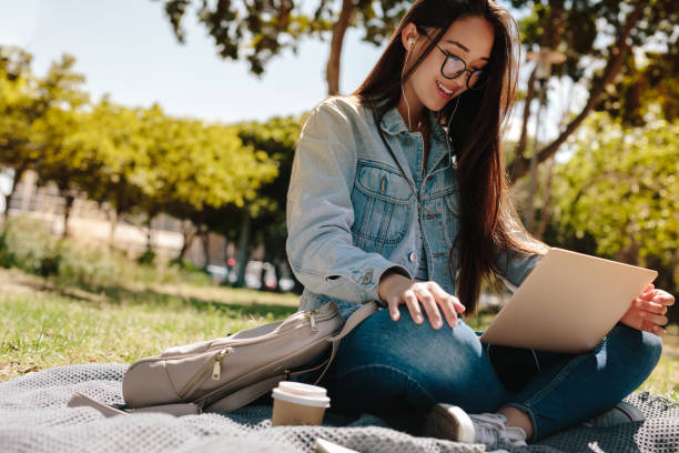 istock Girl in college campus using a laptop 1135931225