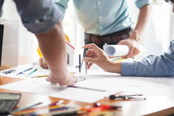 istock Engineers and businessmen are discussing construction projects in workplace 1135932178