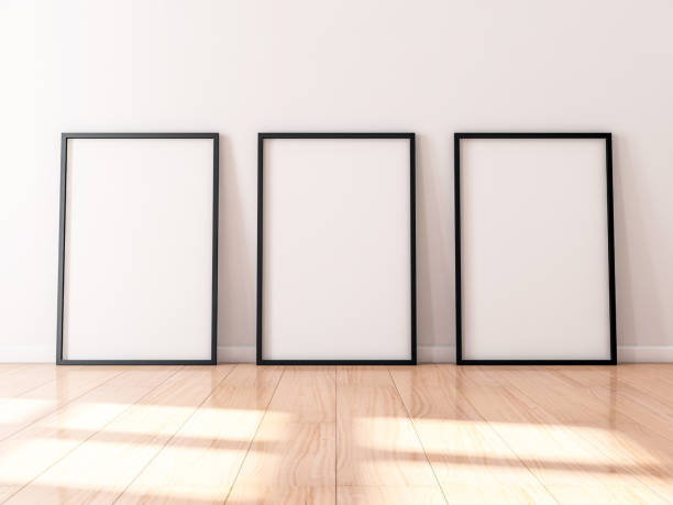 istock Three black Frames Mockup with poster canvas standing on wooden floor 1135933790