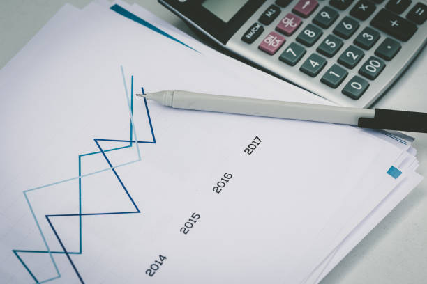 istock FINANCIAL PAPER CHARTS AND GRAPH CONCEPT 1135933868
