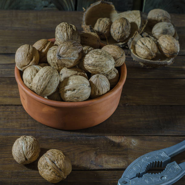 istock Walnut still life on a wooden background. 1135934182