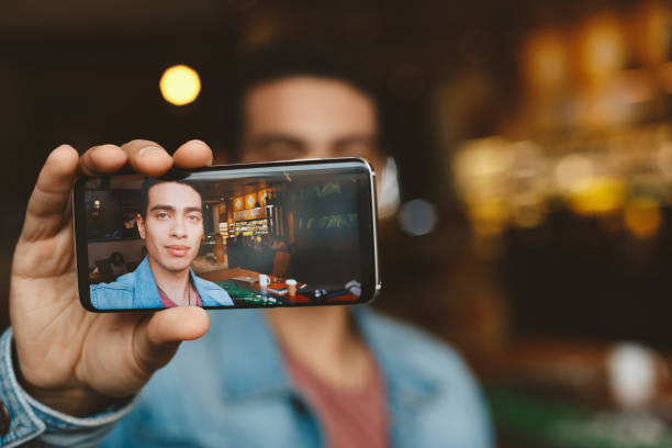 istock Handsome young man making selfie and smiling 1135936398