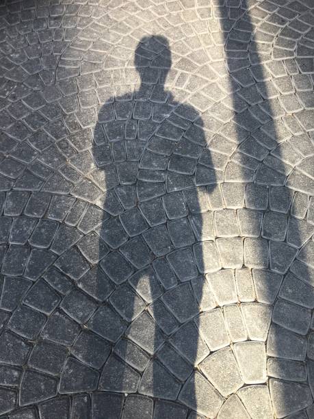 istock silhouette on a street 1135940065