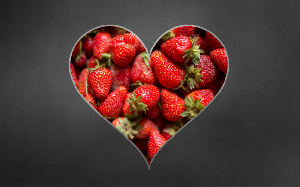 istock Strawberries in heart shape concept 1135941145