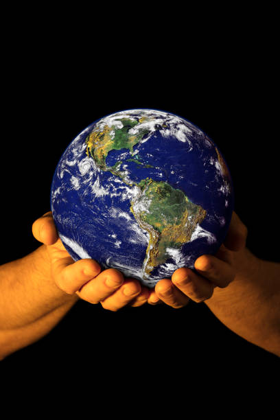 istock Hands holding the Earth with North America visible 1135941269