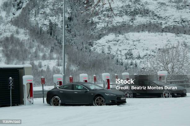 Tesla Cars Charging In Electric Station Stock Photo - Download Image Now - Norway, Electric Vehicle, Electric Car