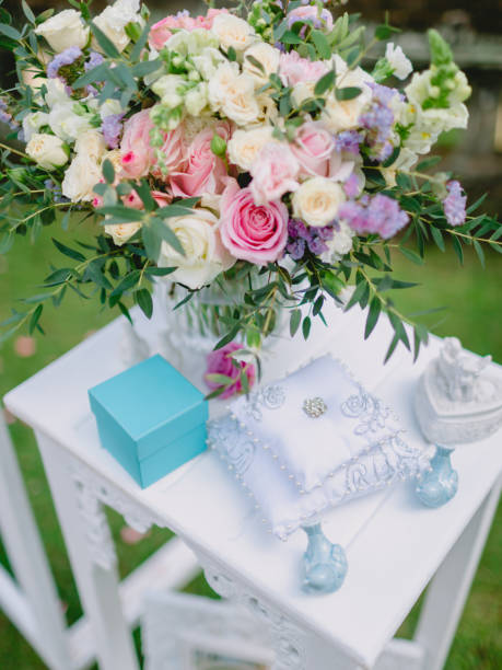 istock Bouquet with blue gift. Wedding day with decor. 1135942324