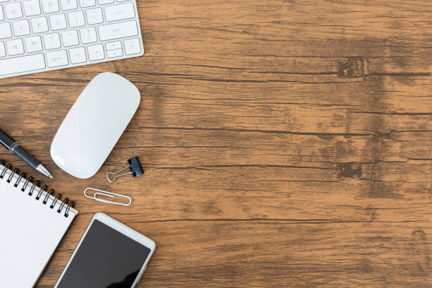 istock Top View Work space, office desk with computer,smartphone and office supplies with copy space 1135942357