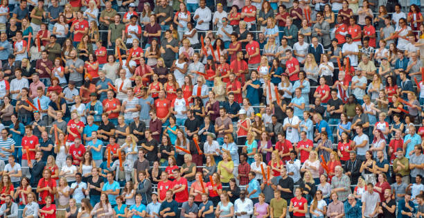 istock Group of spectators cheering in stadium 1135943550