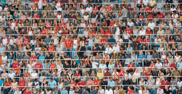 istock Group of spectators cheering in stadium 1135943553