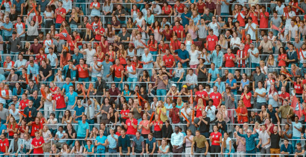 istock Group of spectators cheering in stadium 1135943563