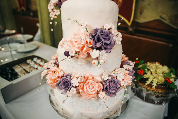 istock Wedding cake with sugar flowers. Traditional pastry. Reception at the restaurant. 1135945710