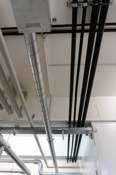 istock metal and plastic pipe system on the cellar ceiling of an apartment building 1135945917