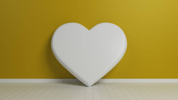 istock White Heart Shape On Yellow Background 1135945929