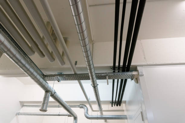istock metal and plastic pipe system on the cellar ceiling of an apartment building 1135945939