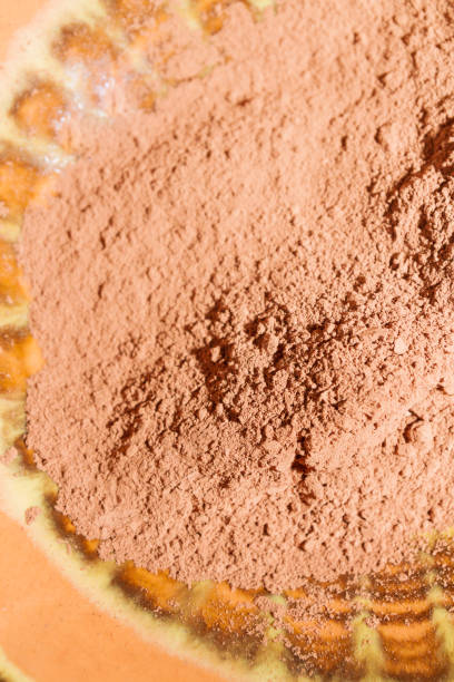 istock Dry cocoa powder poured into a brown ceramic plate 1135948605