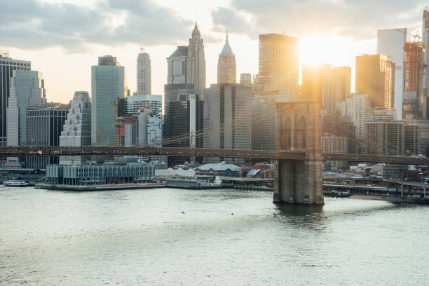istock View of New York Skyline and Brooklyn Bridge during sunset 1135952899