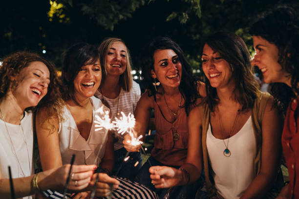 istock Friends having fun together with sparklers 1135953628