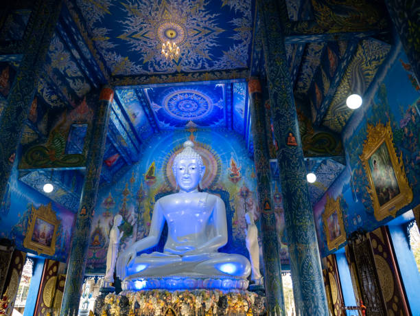 istock White Buddha Sitting in The Blue Light at The Church 1135954468